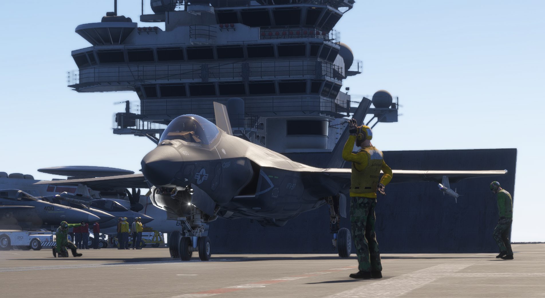 Virtual F-35 on a carrier flight deck with deck crew signaling