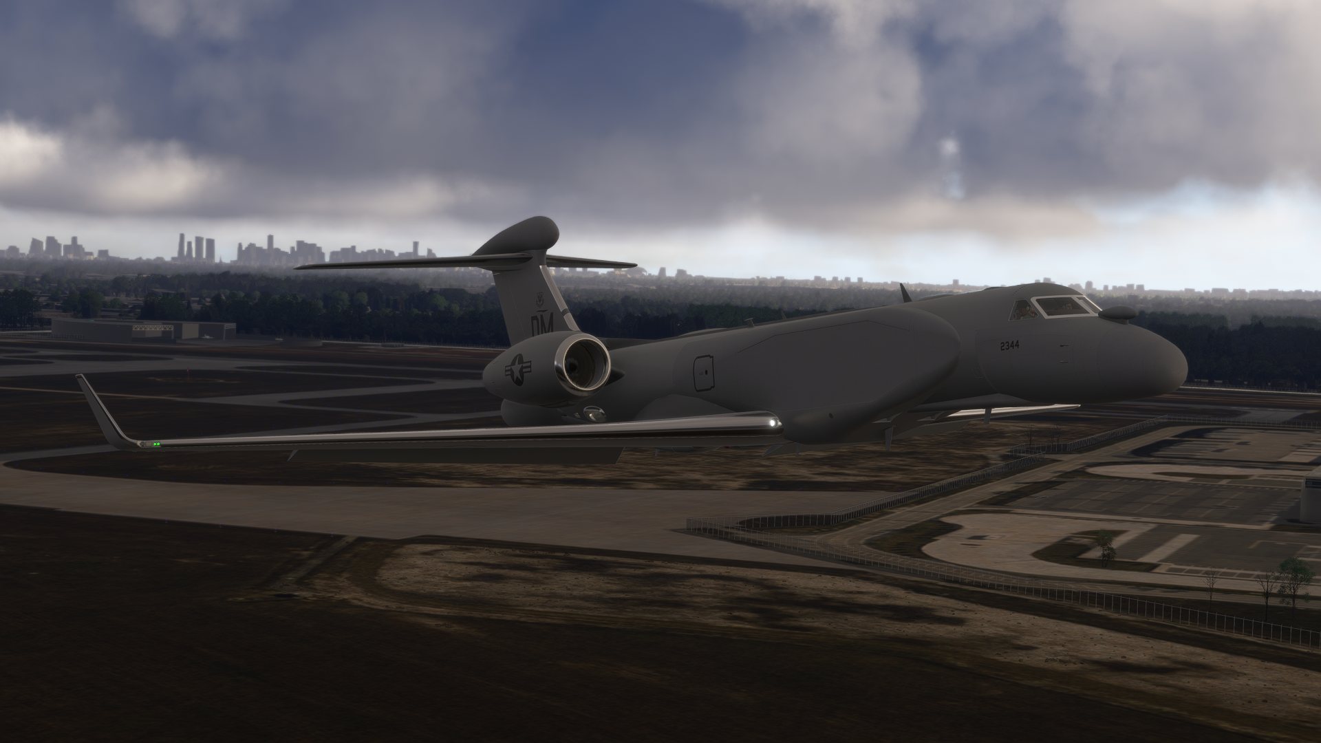 Virtual military transport aircraft flying near a city