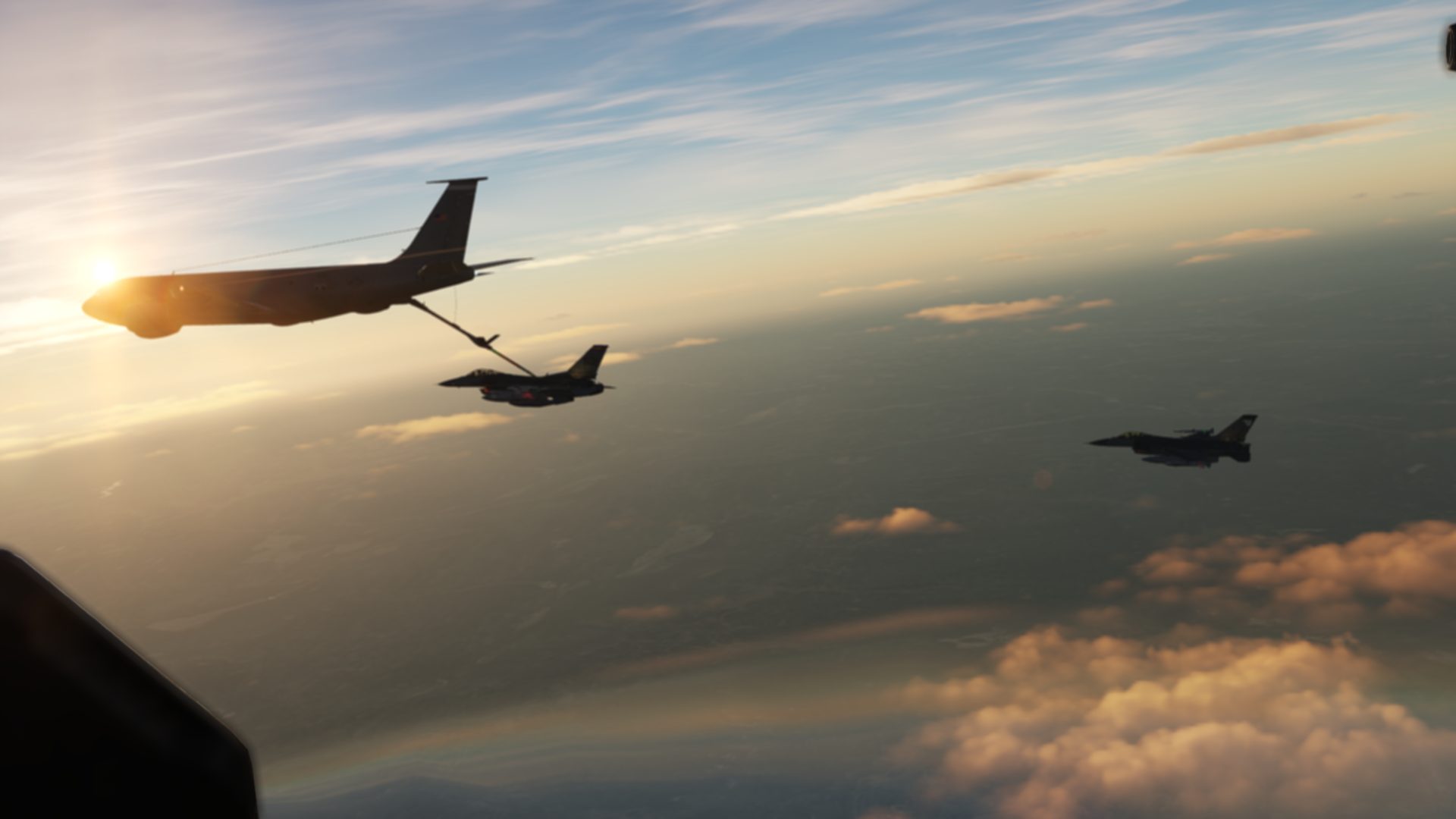Virtual tanker aircraft refueling F-16s at sunset